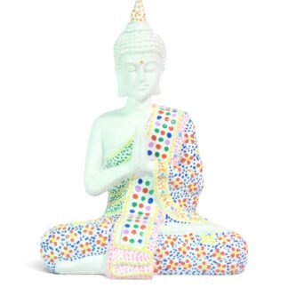 Front view of cream painted Buddha statue seated in prayer with colorful dotted robe