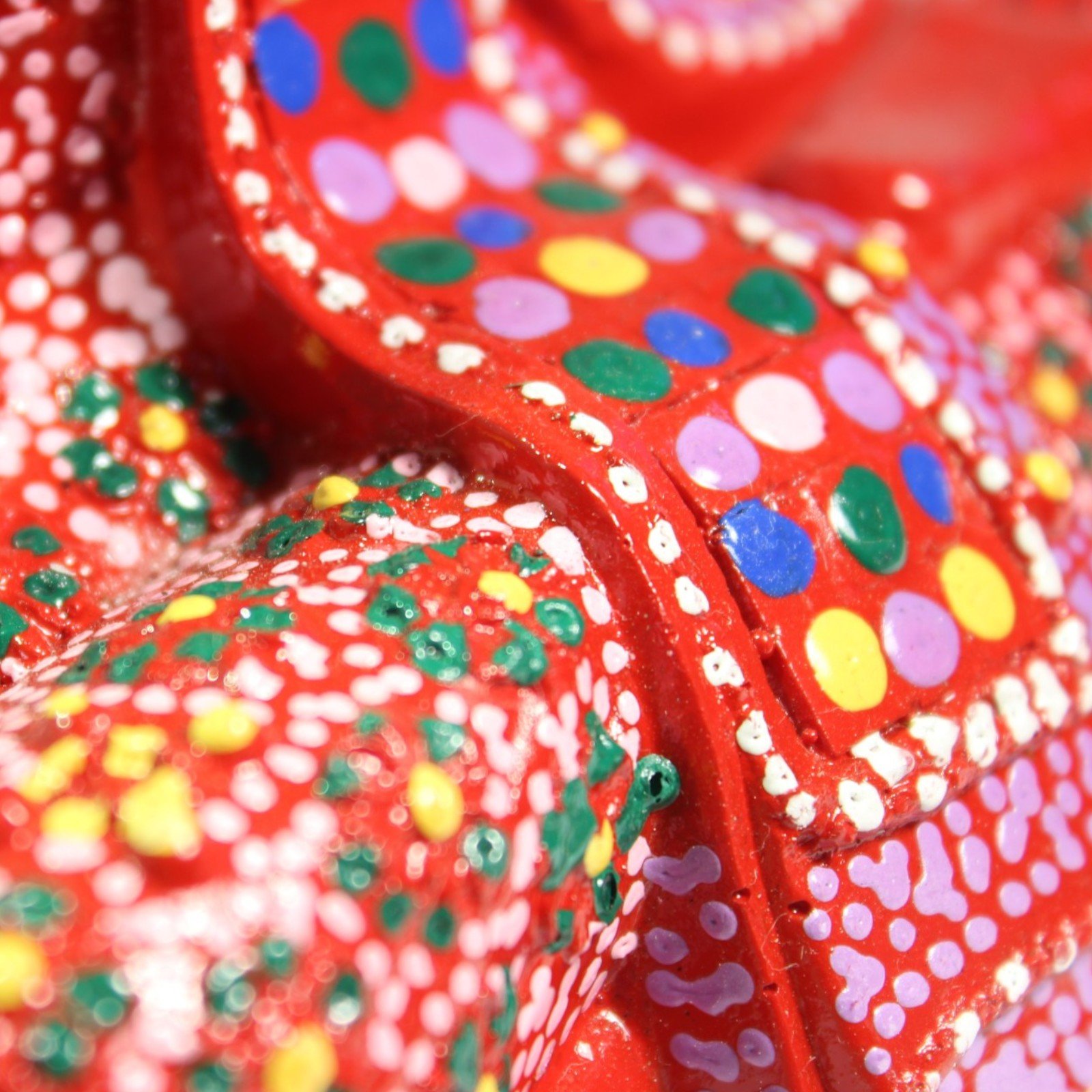 Extreme close-up of multicolor dot pattern on the robe surface