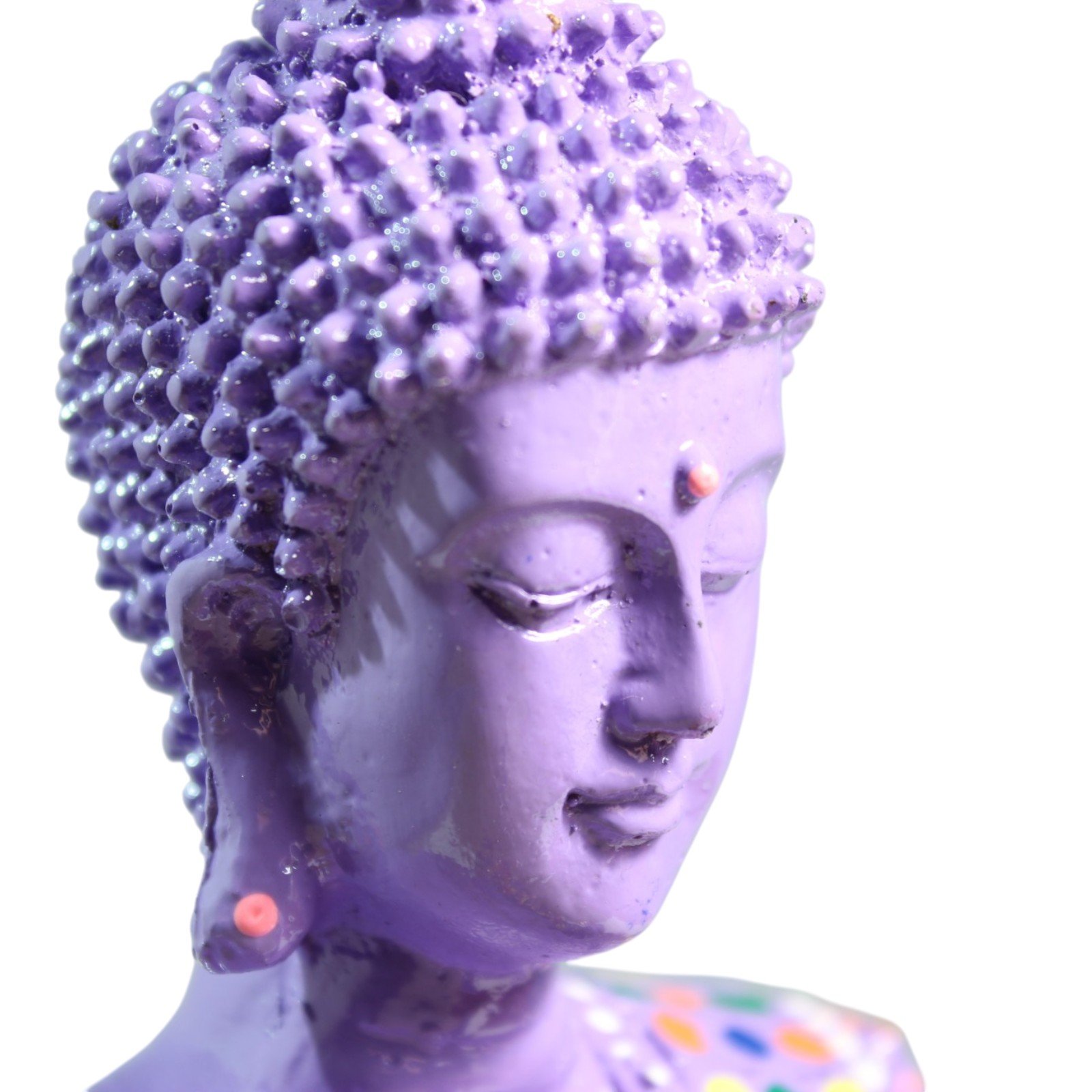 Close-up side portrait of the Buddha's face and textured hair curls