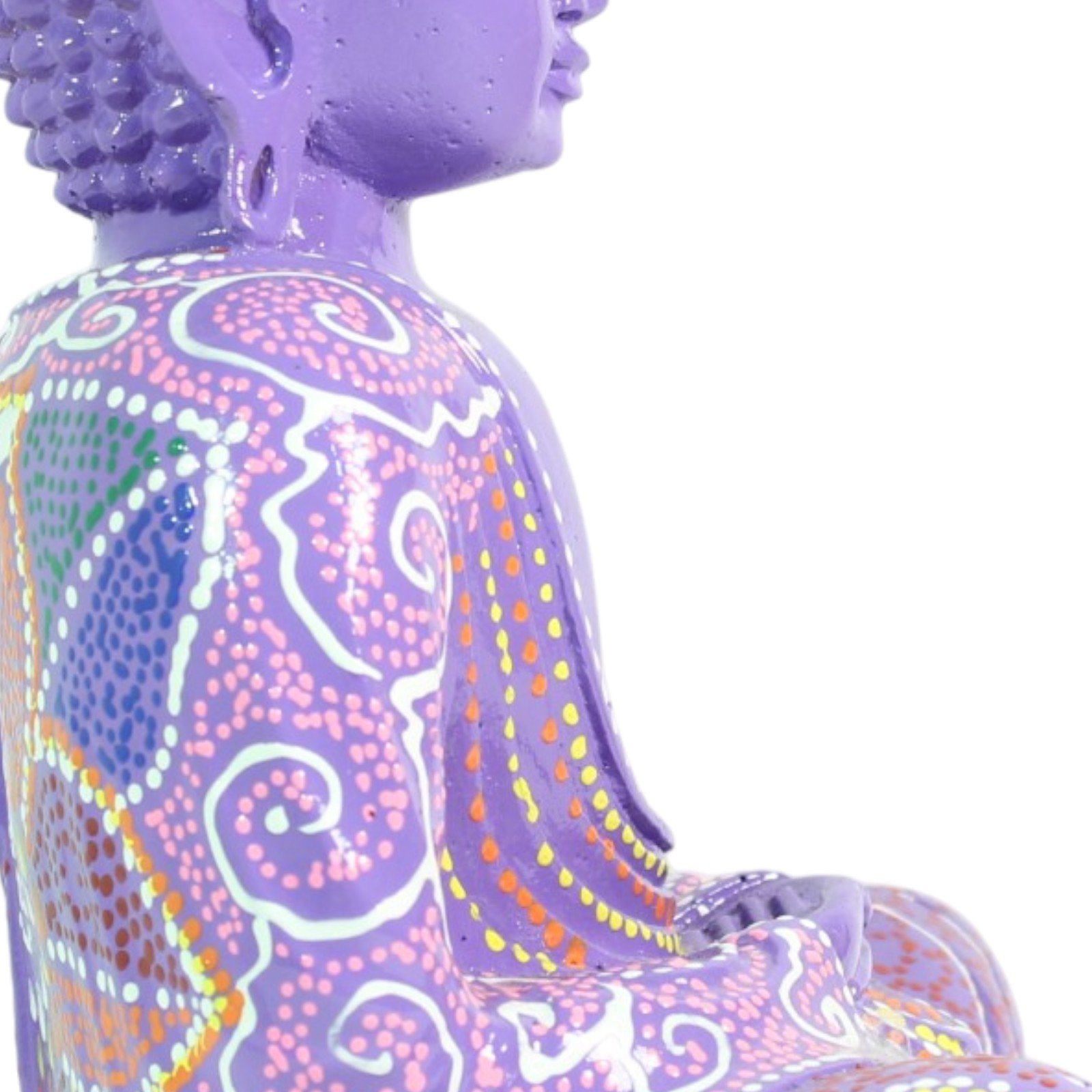 Close-up of the shoulder and seated arm showing layered dot and swirl painting