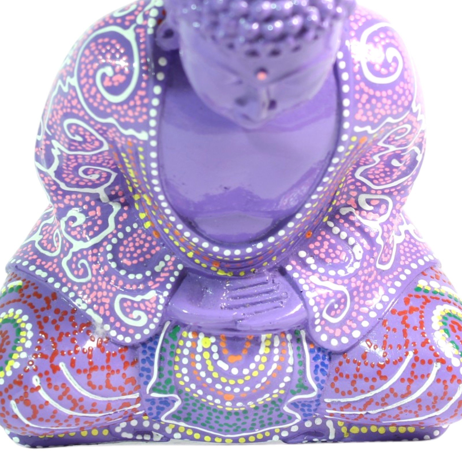 Top-down view of the Buddha figurine showing the crown of the head and folded hands