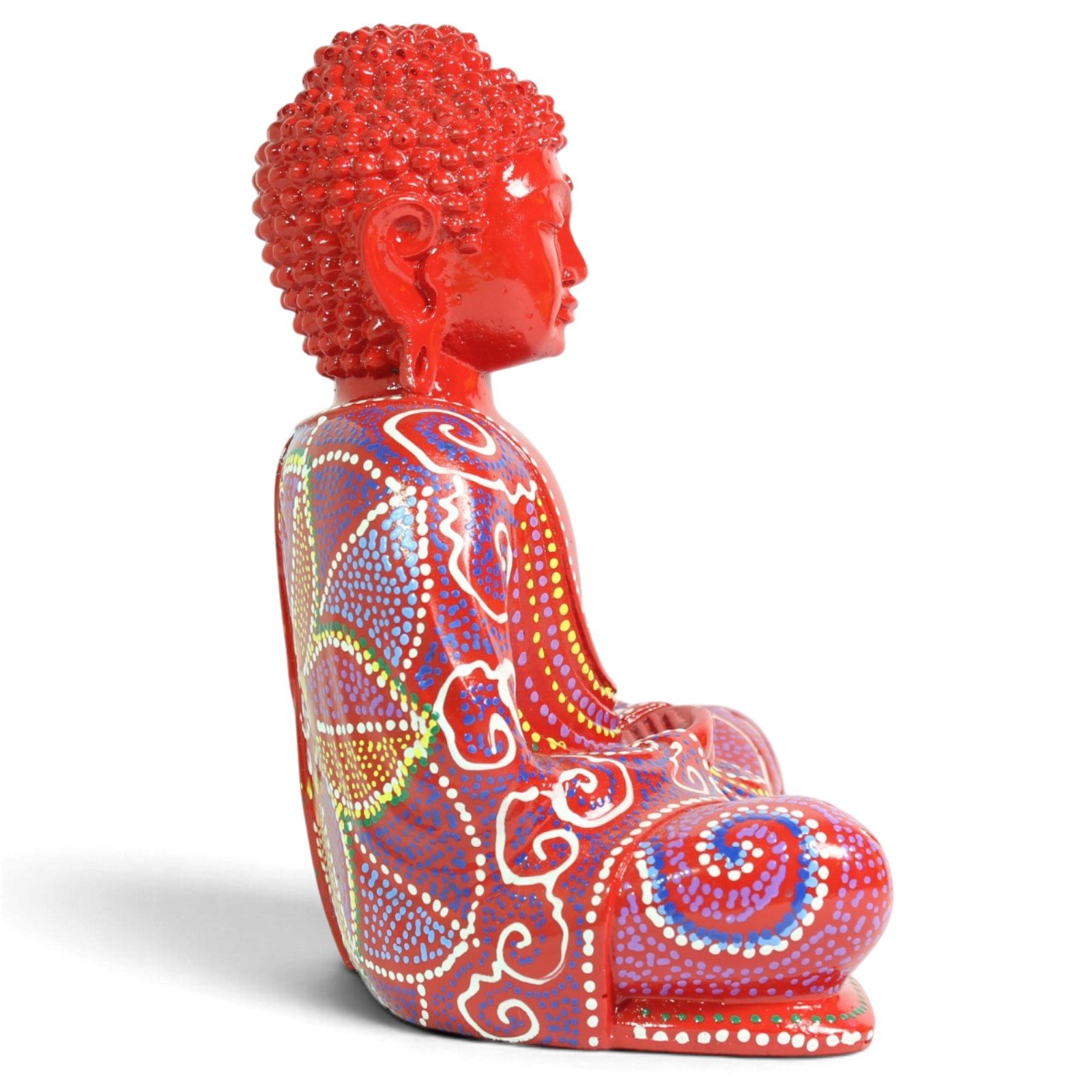 Back angle view of red seated Buddha showing painted mandala pattern on robe