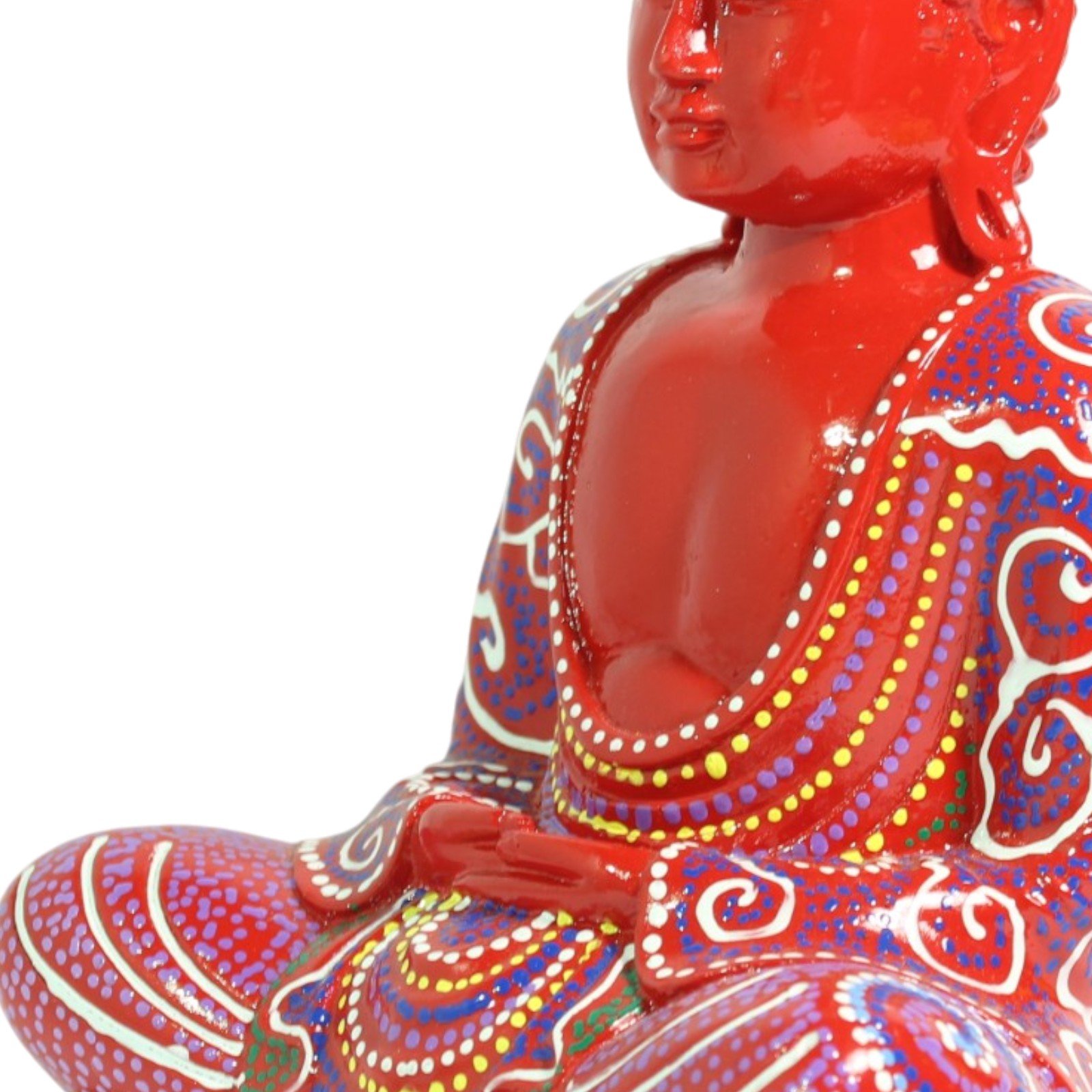 Close-up of the torso showing painted robe folds and layered dot decoration