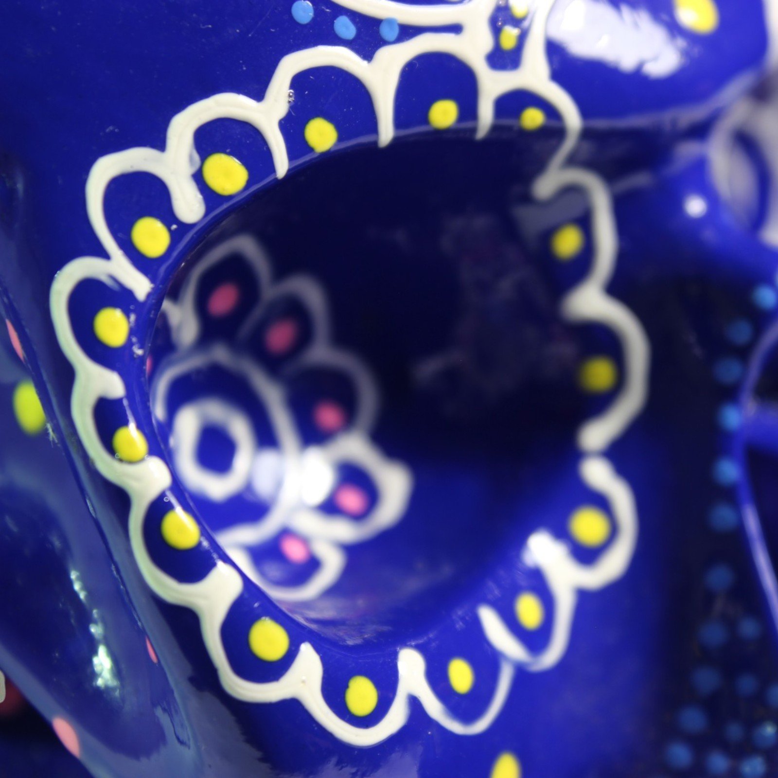 Rear view of the skull highlighting a large painted flower medallion