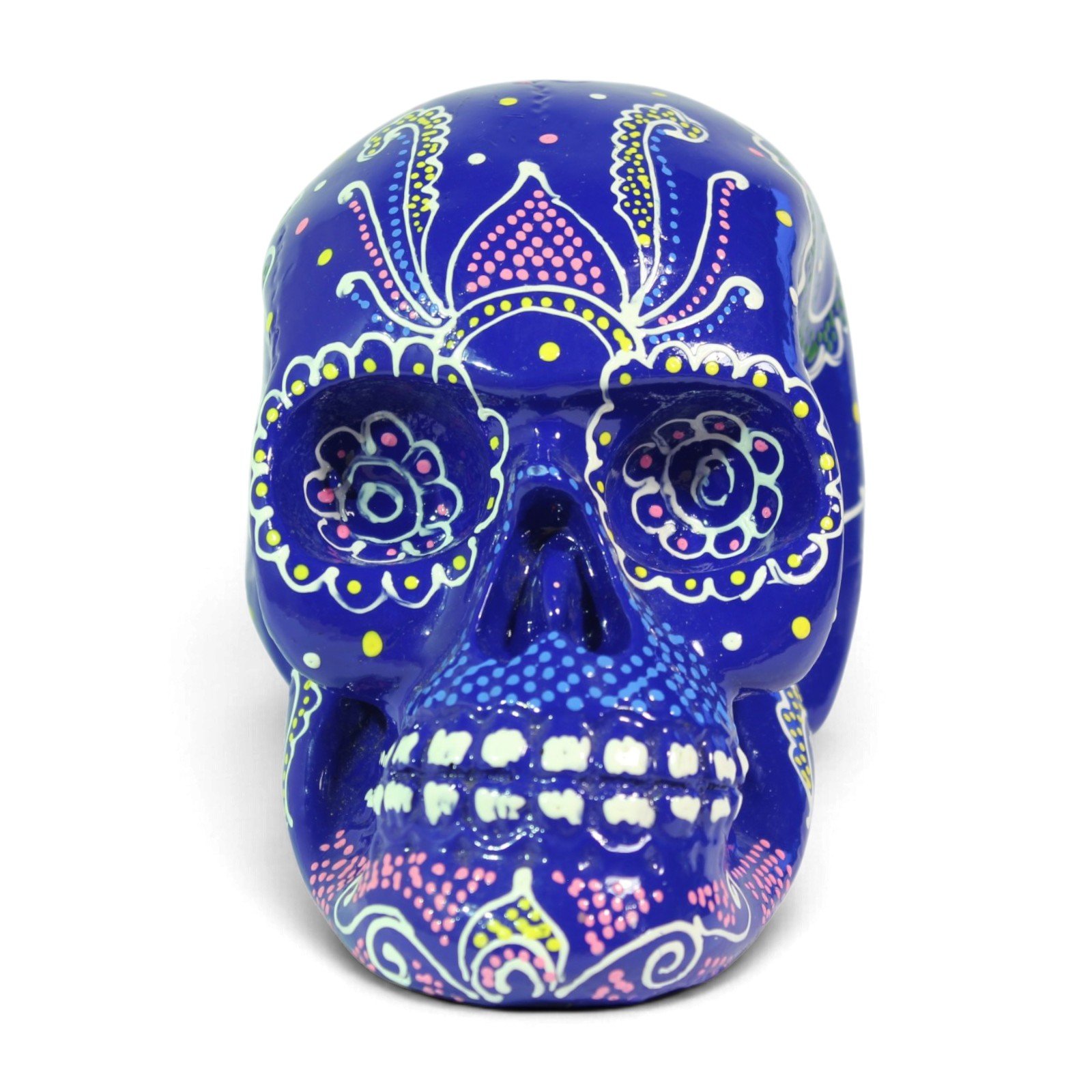 Front view of a dark blue resin skull hand-painted with colorful paisley and dot patterns