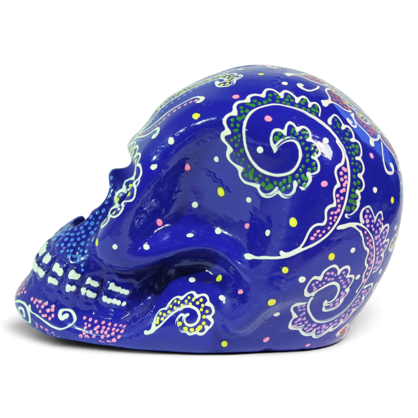 Side profile view of the dark blue skull highlighting swirling paisley designs