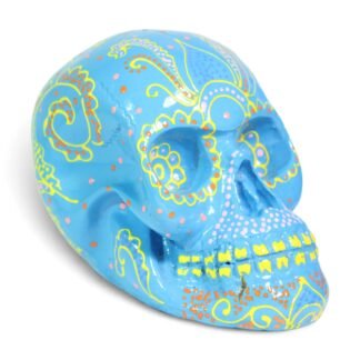 Three-quarter view of light blue painted skull showing full face and side patterns
