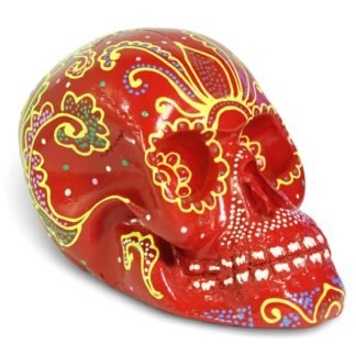 Front-left angle view of red hand-painted resin skull with floral patterns