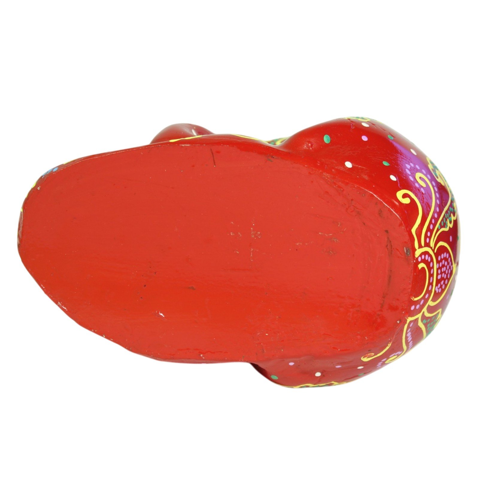 Back angle view of the red skull revealing dotted floral motifs