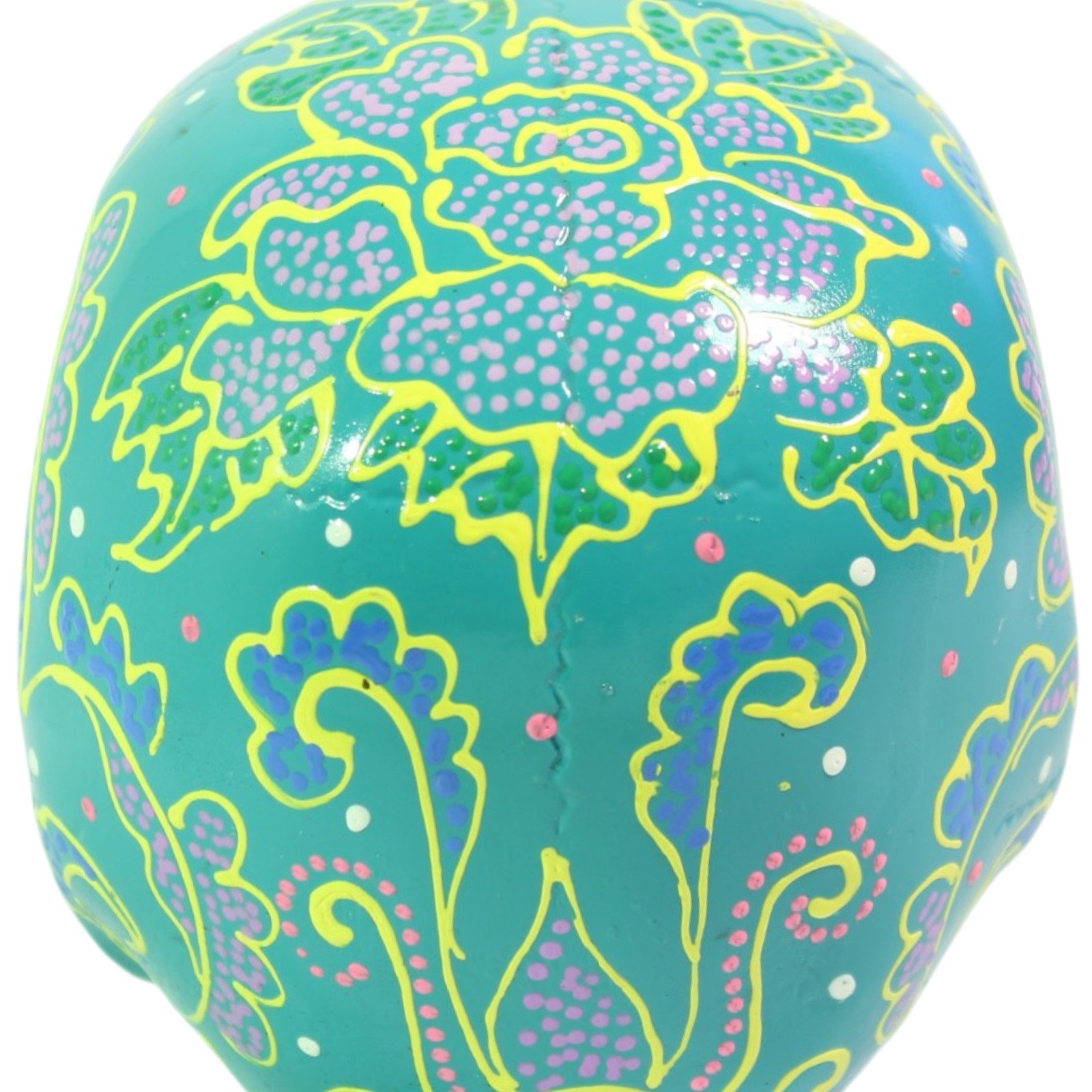 Top-down view of the skull crown showing dense floral and dot patterning