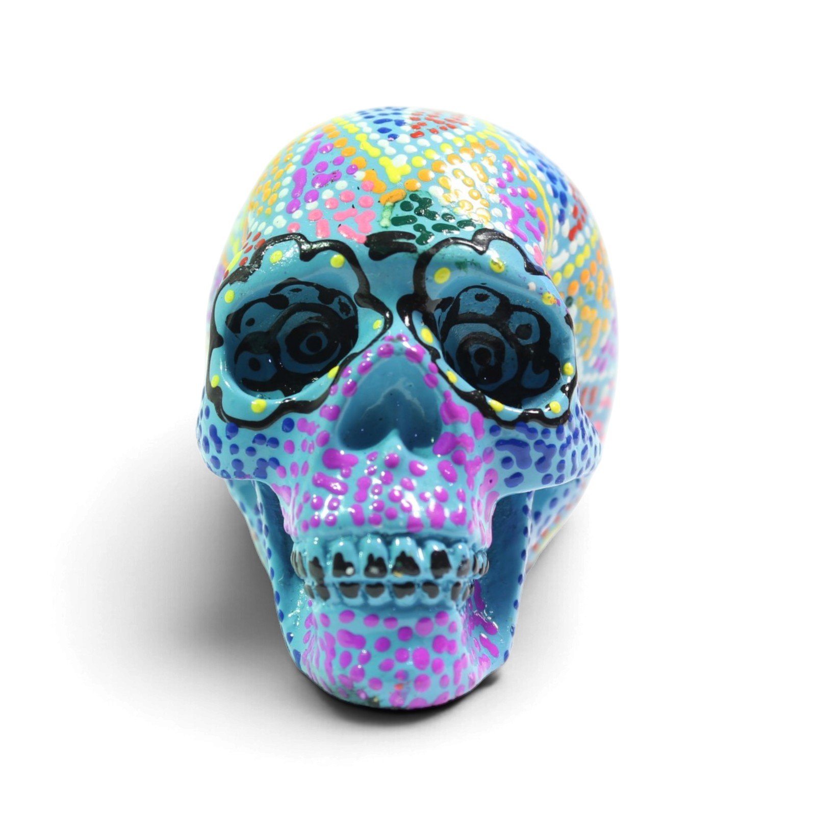 Front view of the hand-painted aqua skull figurine with colorful dotted patterns and black-lined eyes