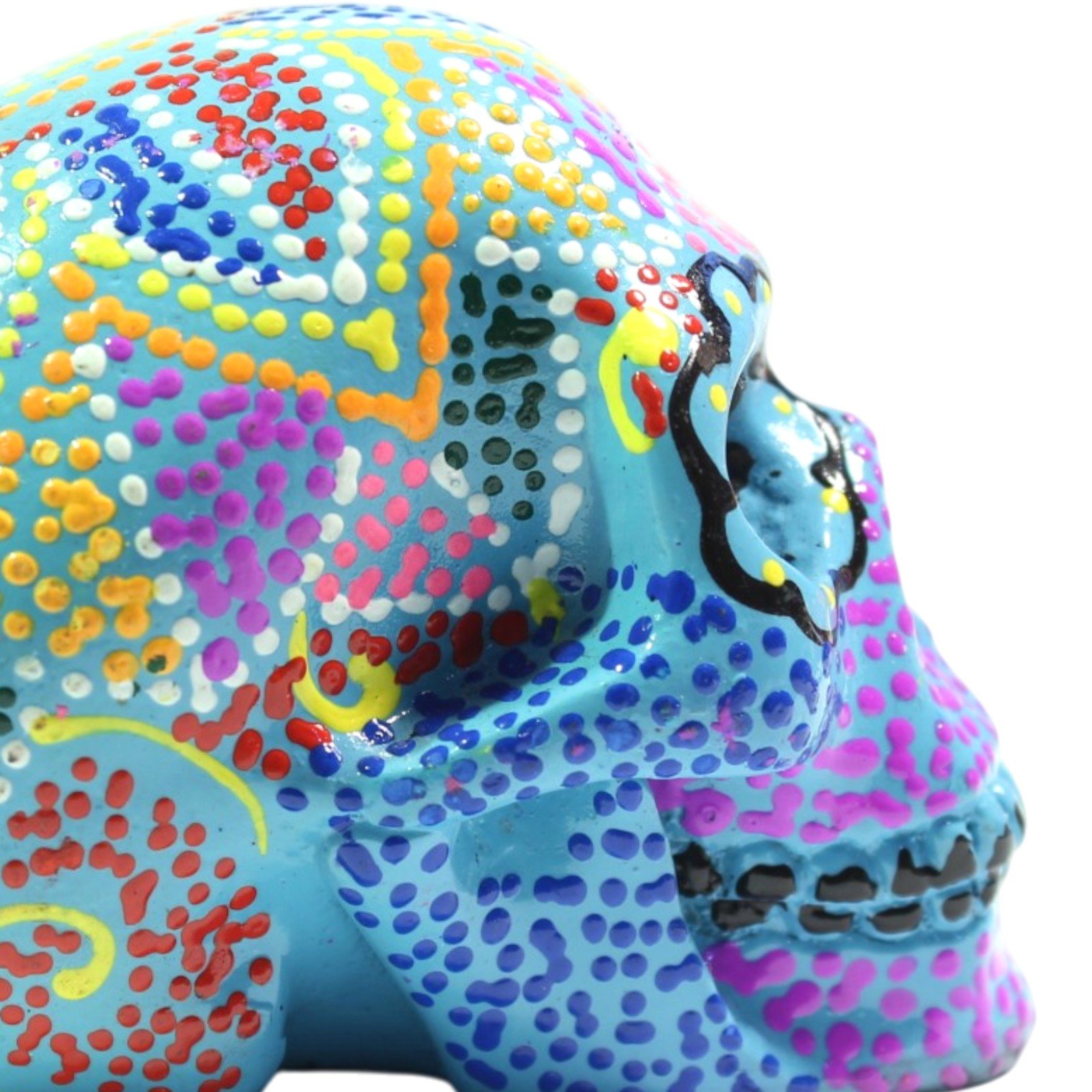 Close-up side view highlighting the painted ear area and dense multicolor dot work on the skull