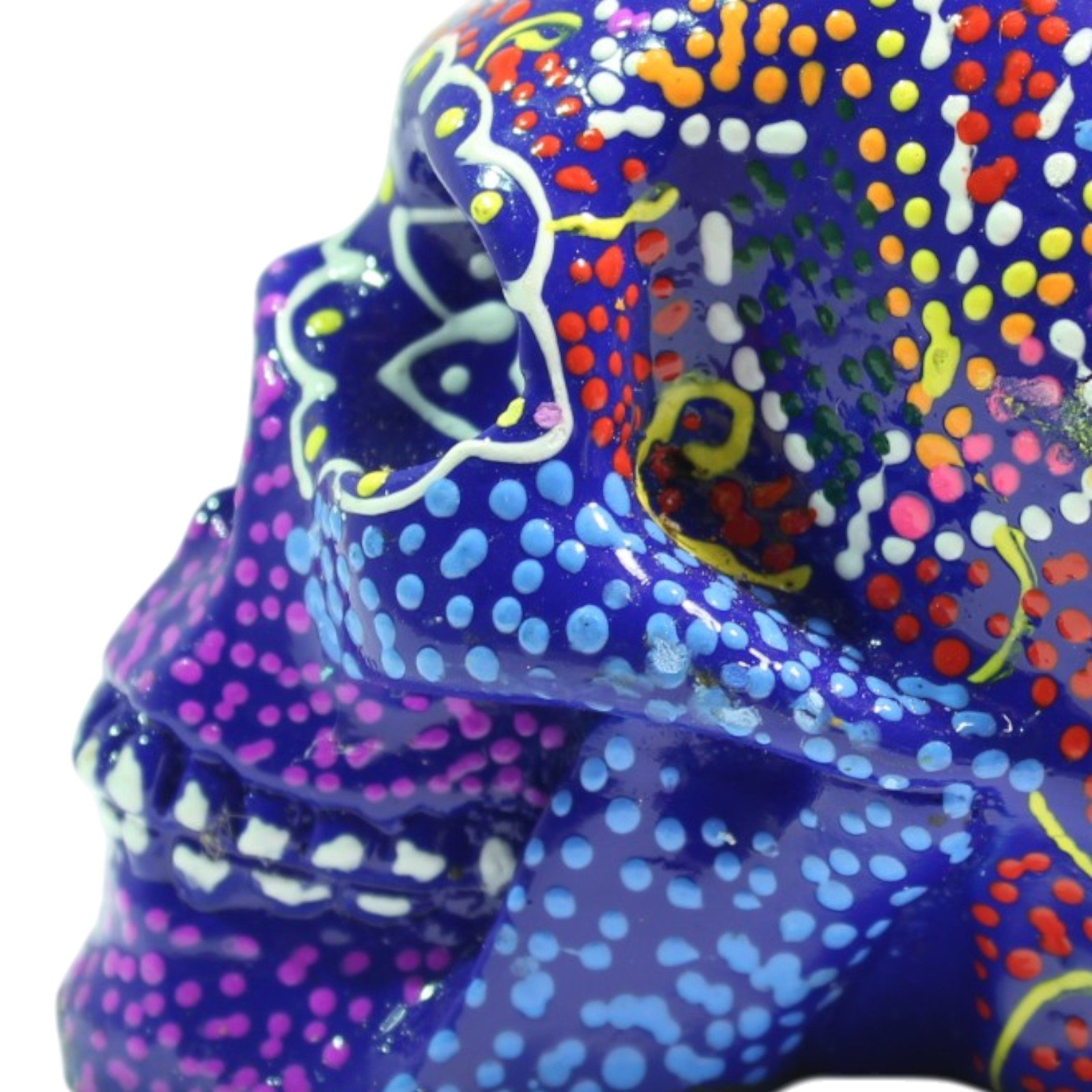 Close-up of the skull's eye socket showing white scalloped outline and dot detailing