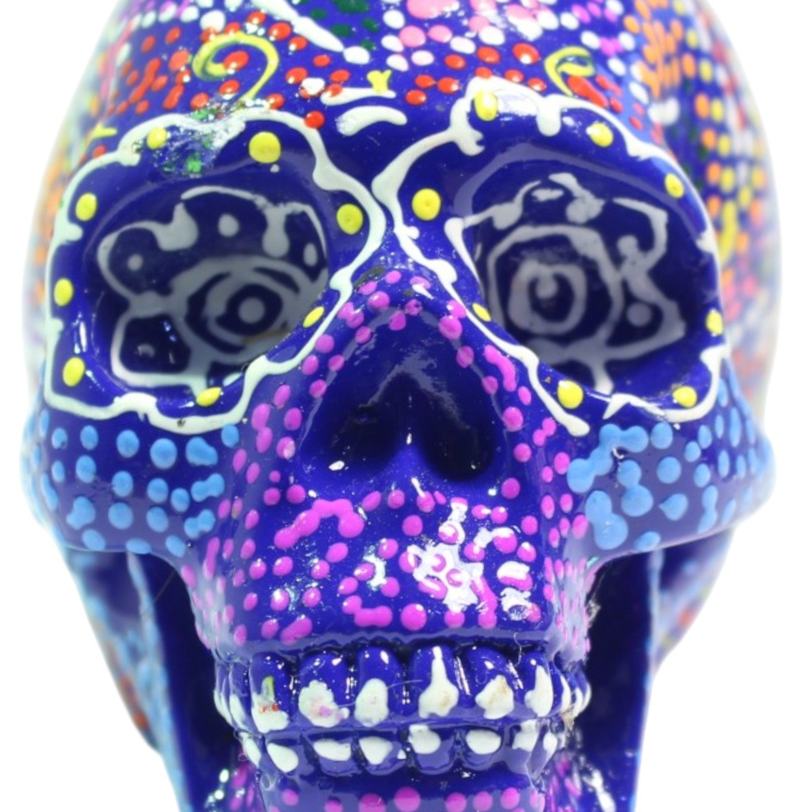 Front view close-up of the skull's face showing both painted eye sockets and teeth