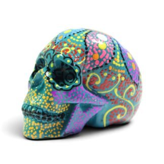 Green hand-painted resin skull figurine, three-quarter angle view