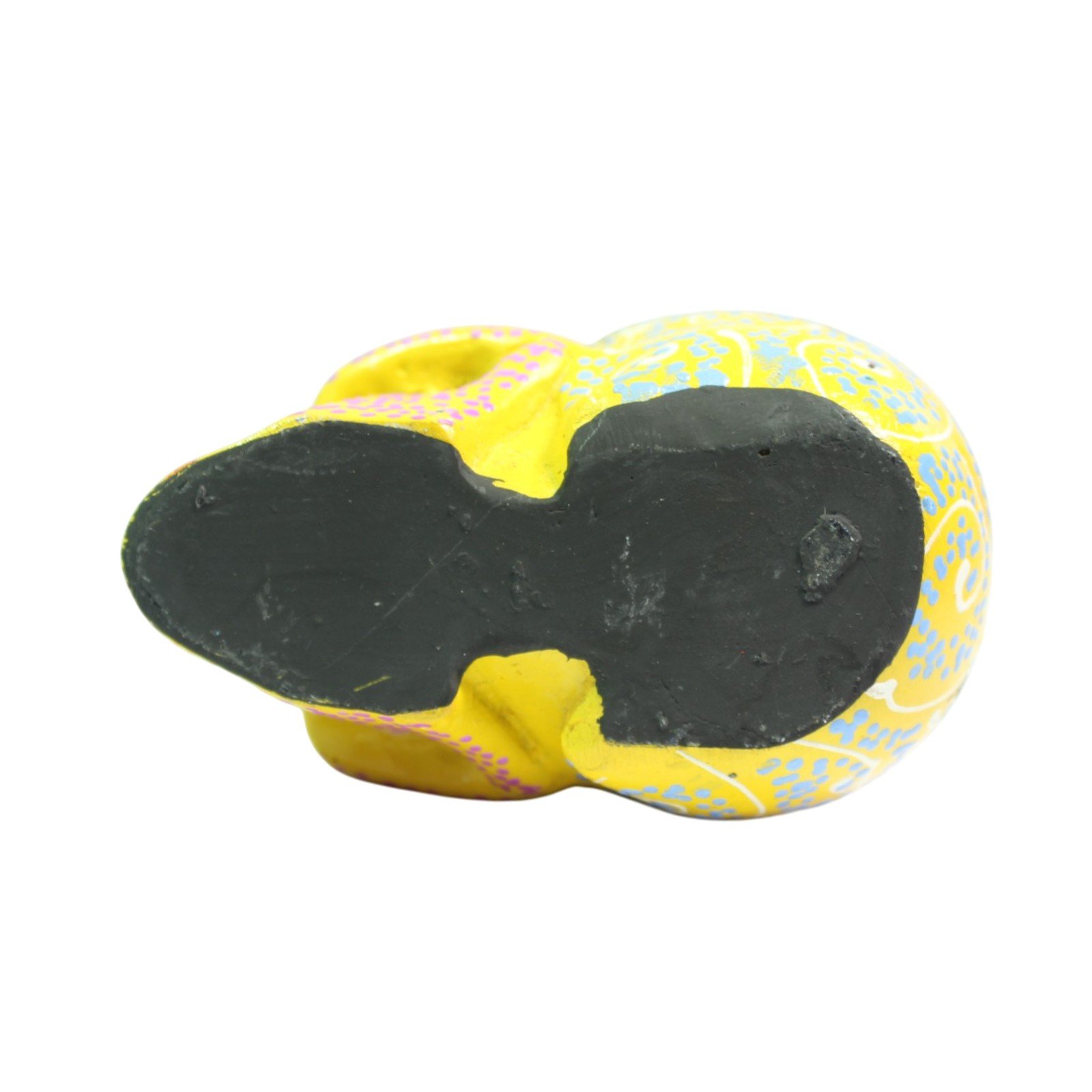 Bottom view of the skull showing flat black base and unpainted underside
