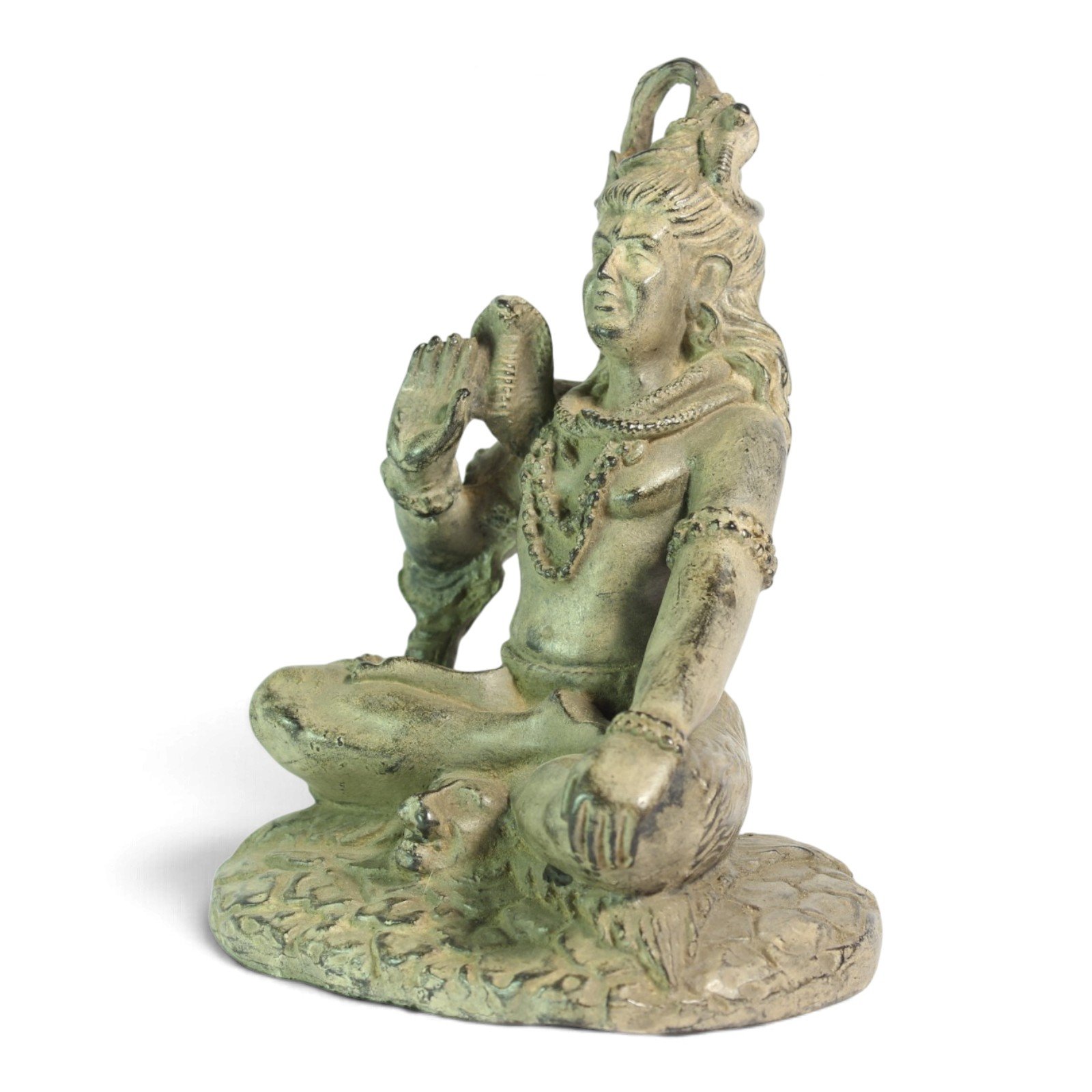 Three-quarter angle view of Shiva statue showing raised arm and seated pose