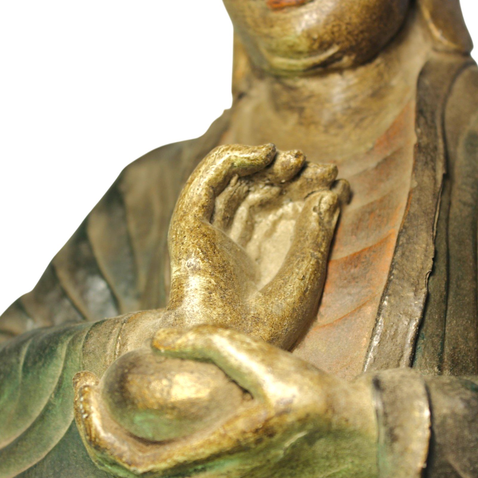 Close-up of the Buddha's clasped hands showing antiquing and finish variation