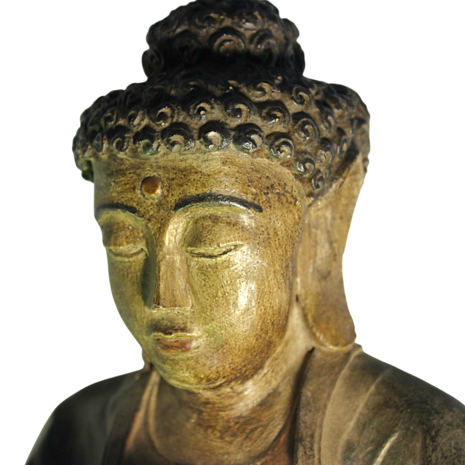 Top-down close-up of the Buddha's curled hair and forehead detail