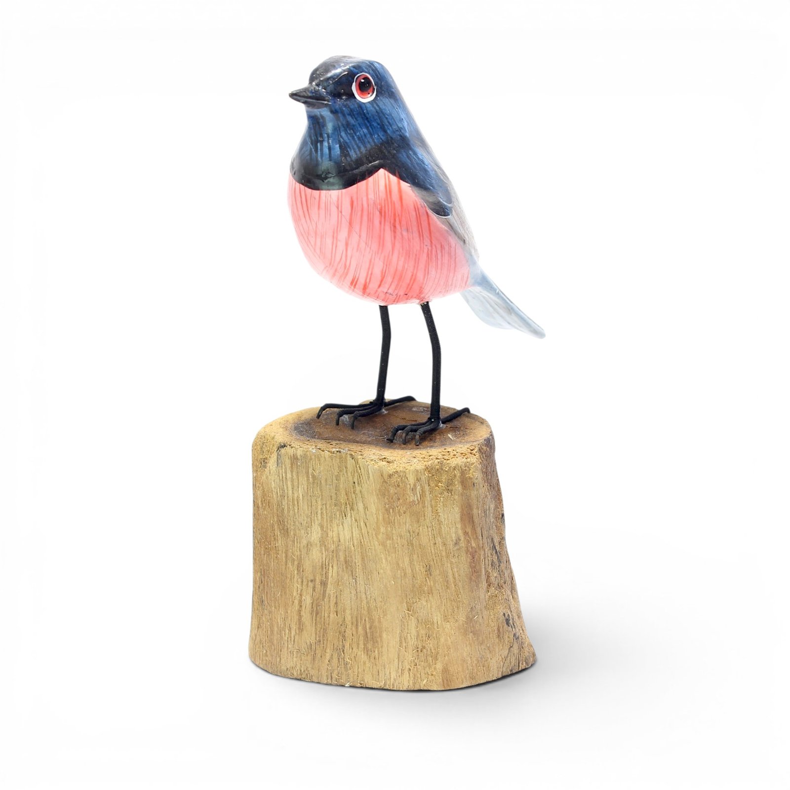 Angled left view of hand-carved wooden bird figurine showing full body detail