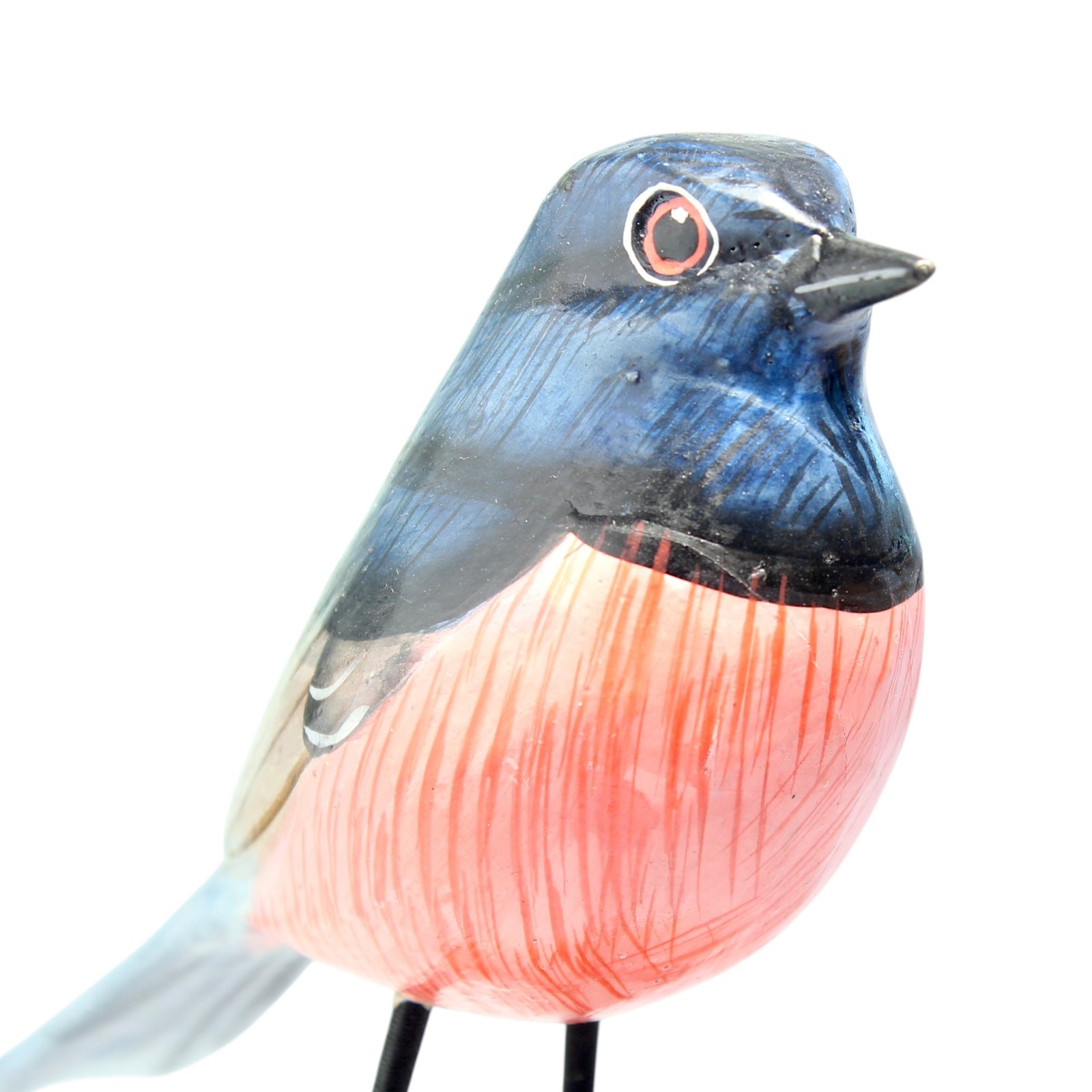 Close-up of hand-painted texture on wooden robin bird figurine