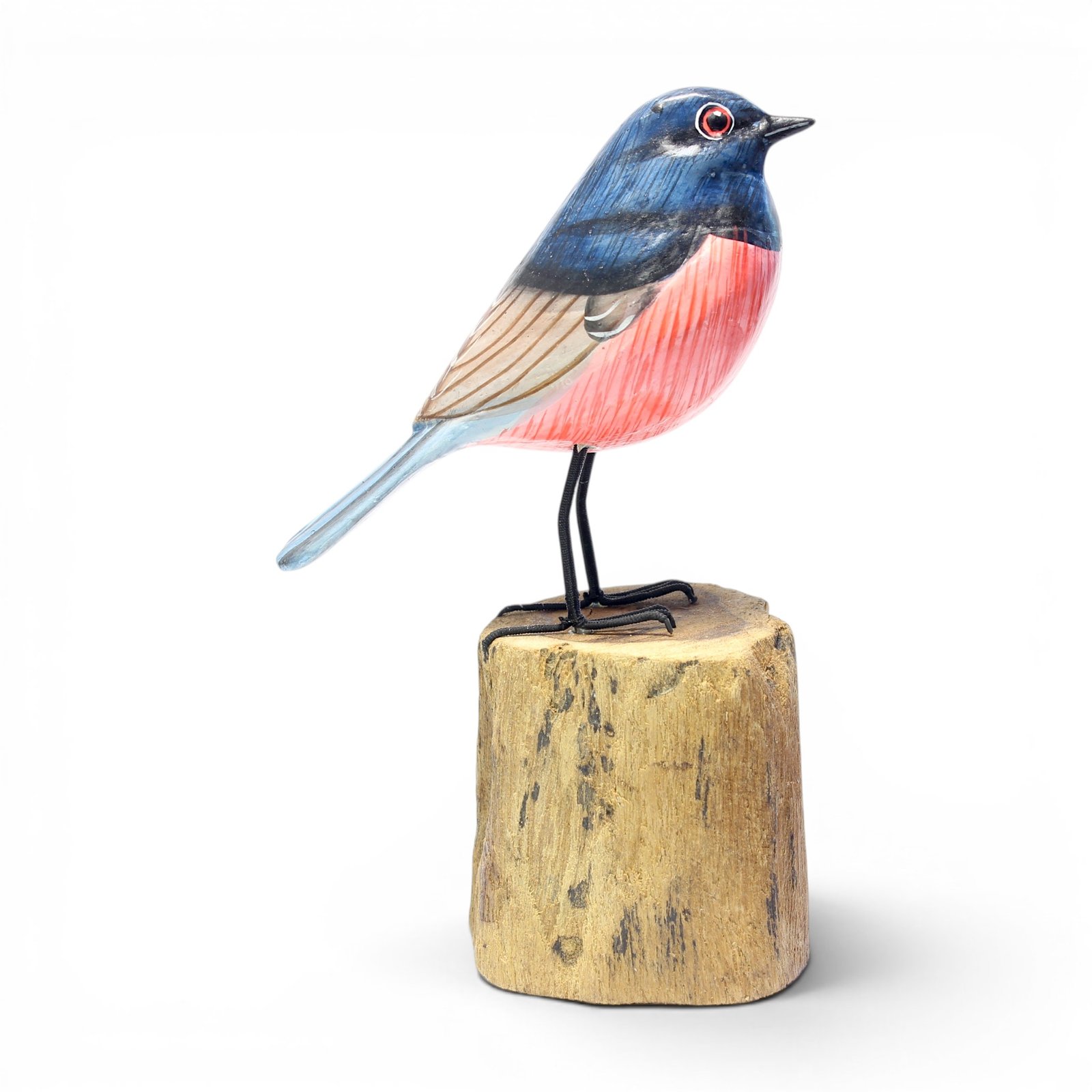 Right side view of hand-carved wooden robin figurine with coral pink chest