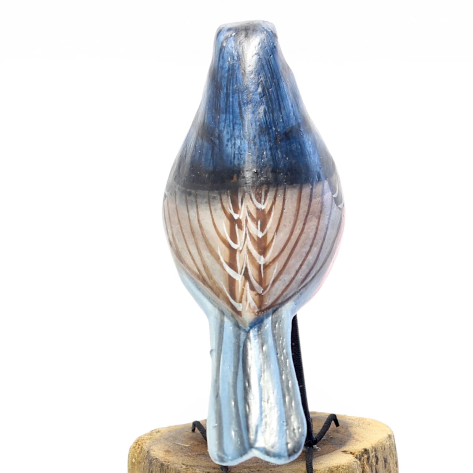 Close-up of hand-painted wing feather detail on wooden robin bird figurine