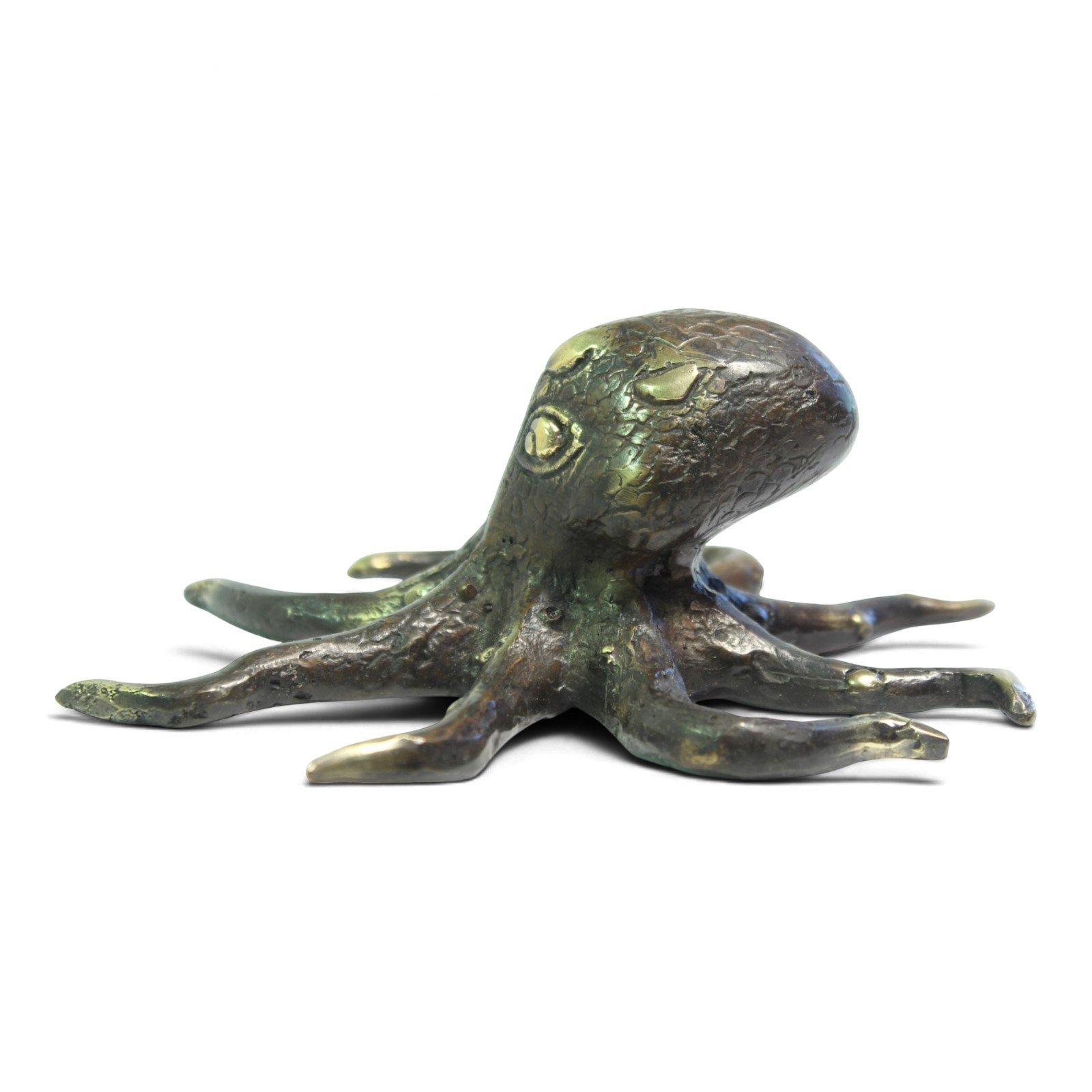 Brass octopus figurine viewed from behind, showing curled arms and patina variation