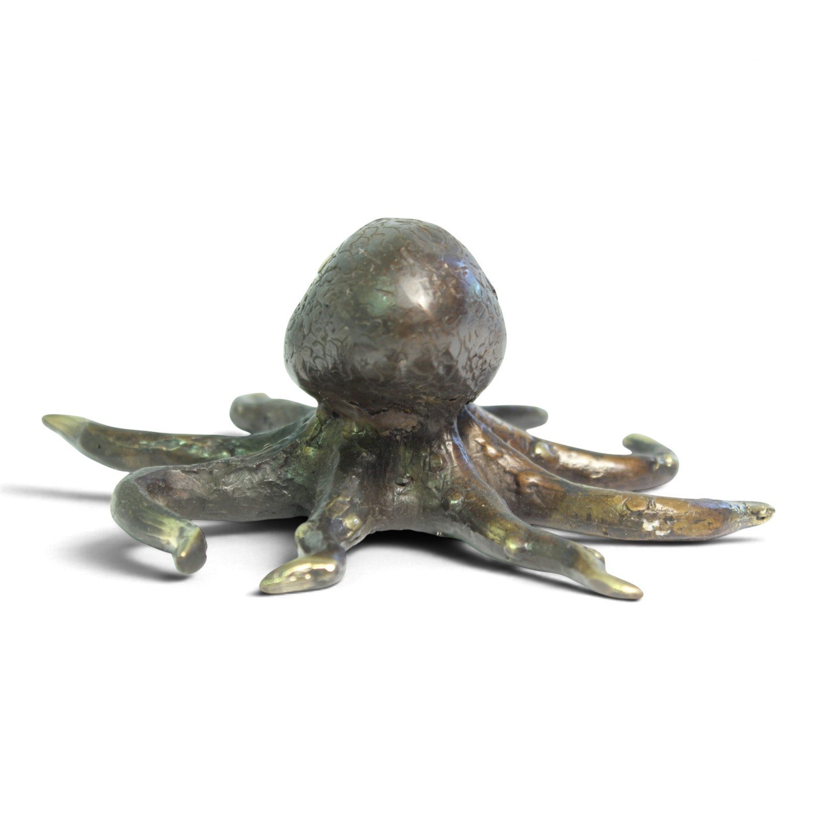 Brass octopus figurine seen from an elevated angle showing all eight arms