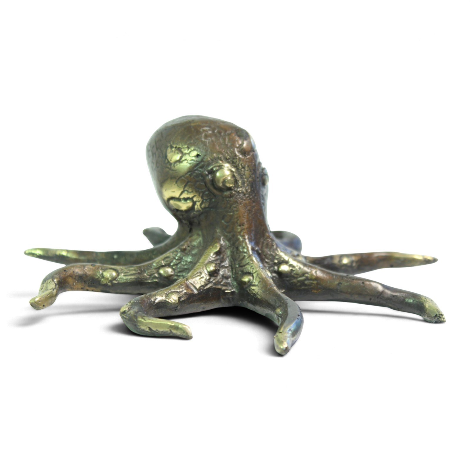Hand-cast brass octopus figurine viewed from the front, showing textured head and arms