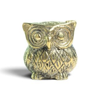 Hand-cast brass owl figurine facing forward, showing spiral eyes and feather detail