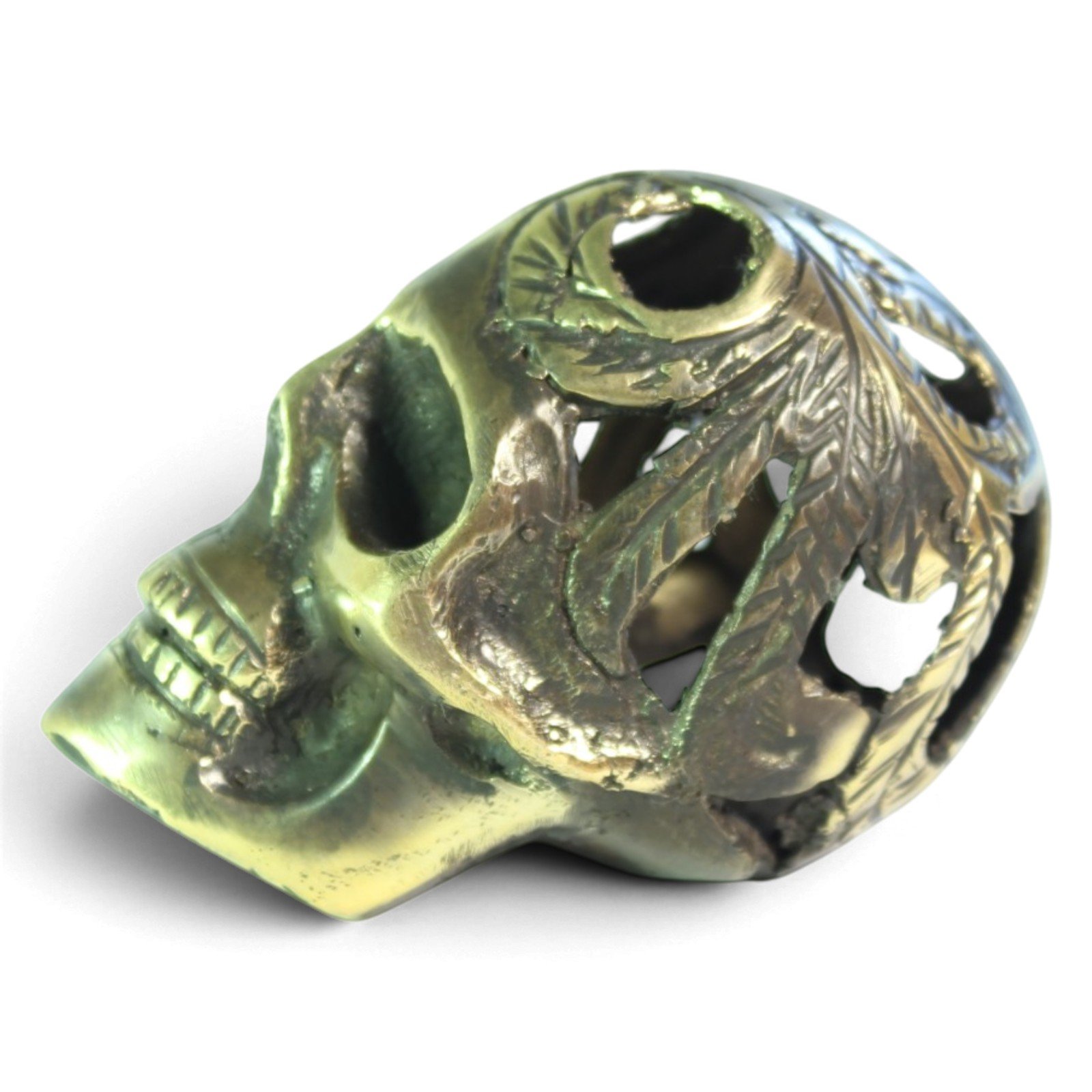 Handvara view of the brass skull figurine showing symmetrical carving and aged finish