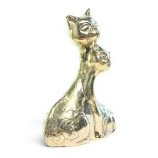 Side view of hand-cast brass twin cats figurine showing nuzzling heads and curved necks