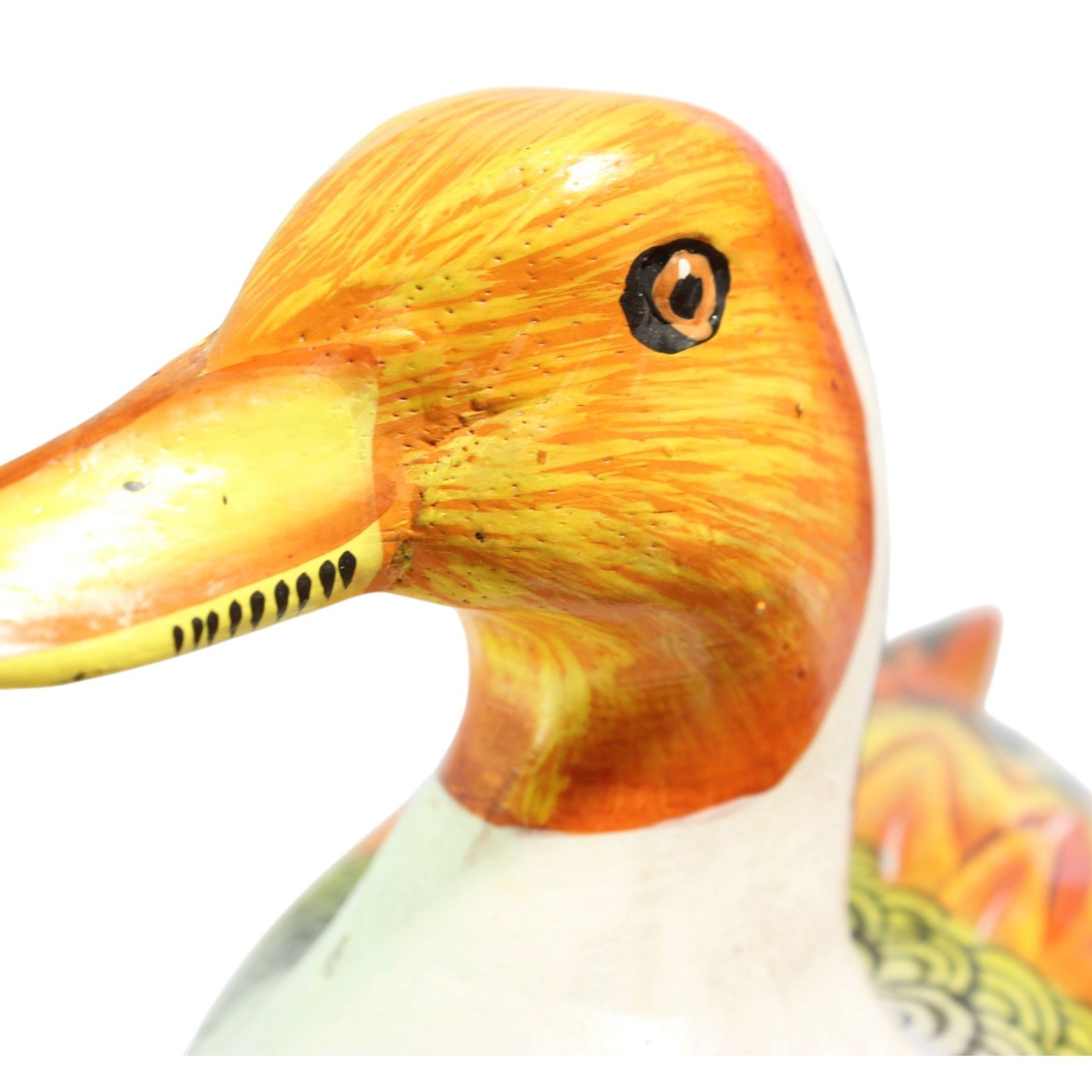 Front close-up of the orange head and yellow bill of the hand-painted wooden duck