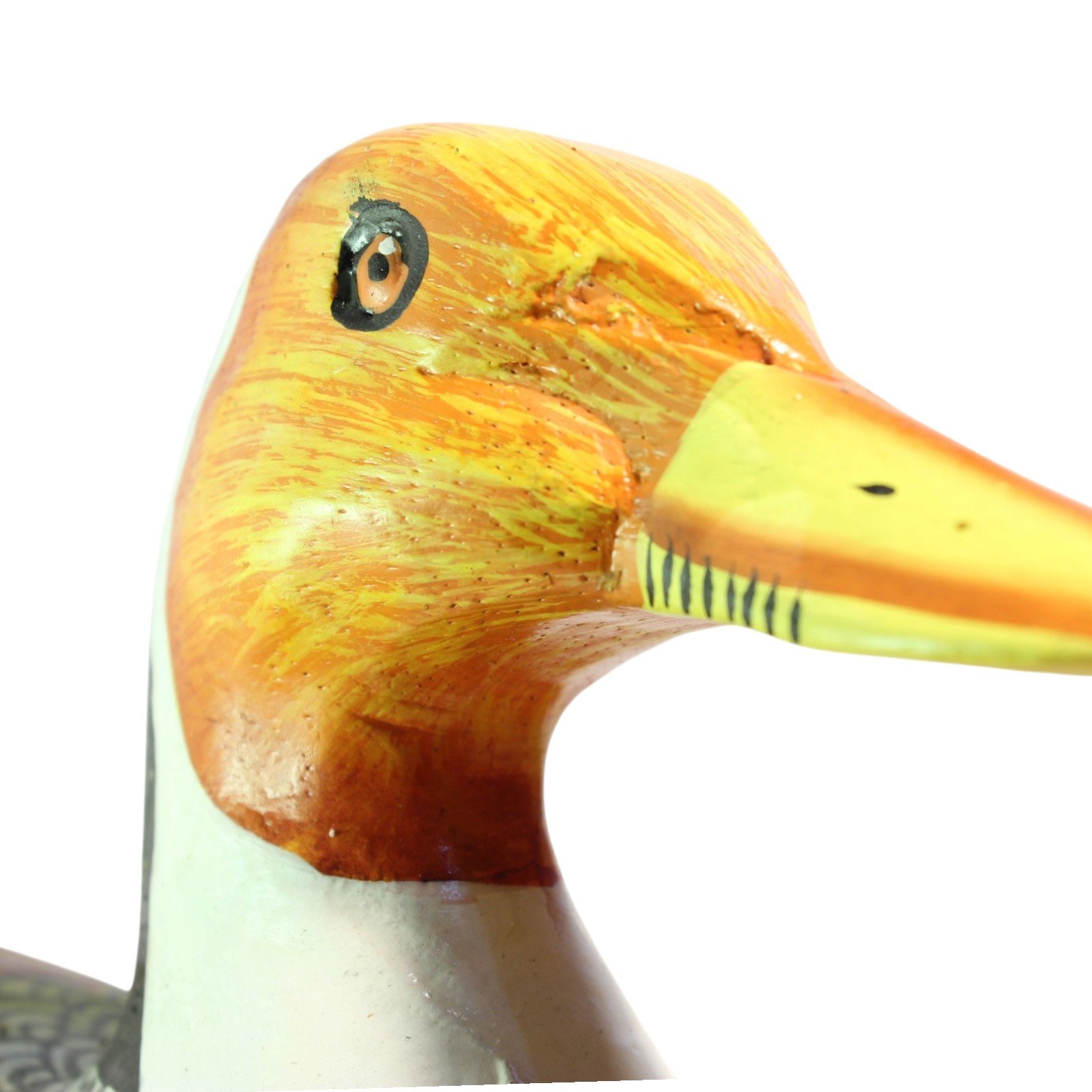 Close-up of the orange head and eye of the hand-painted wooden duck, left side