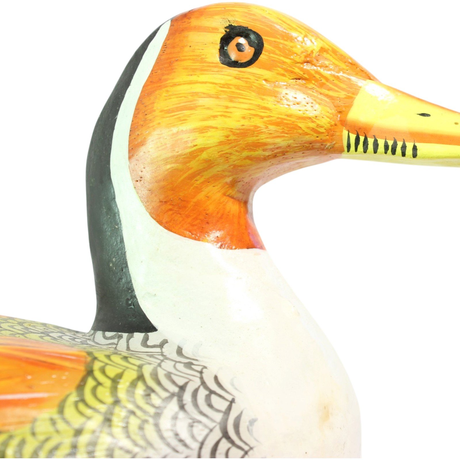 Close-up of the orange head, white neck and painted bill of the wooden duck decoy