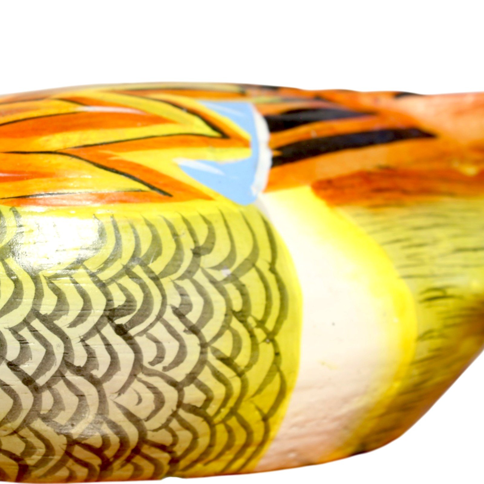 Detail of the scalloped hand-painted wing and flank feathers of the wooden duck